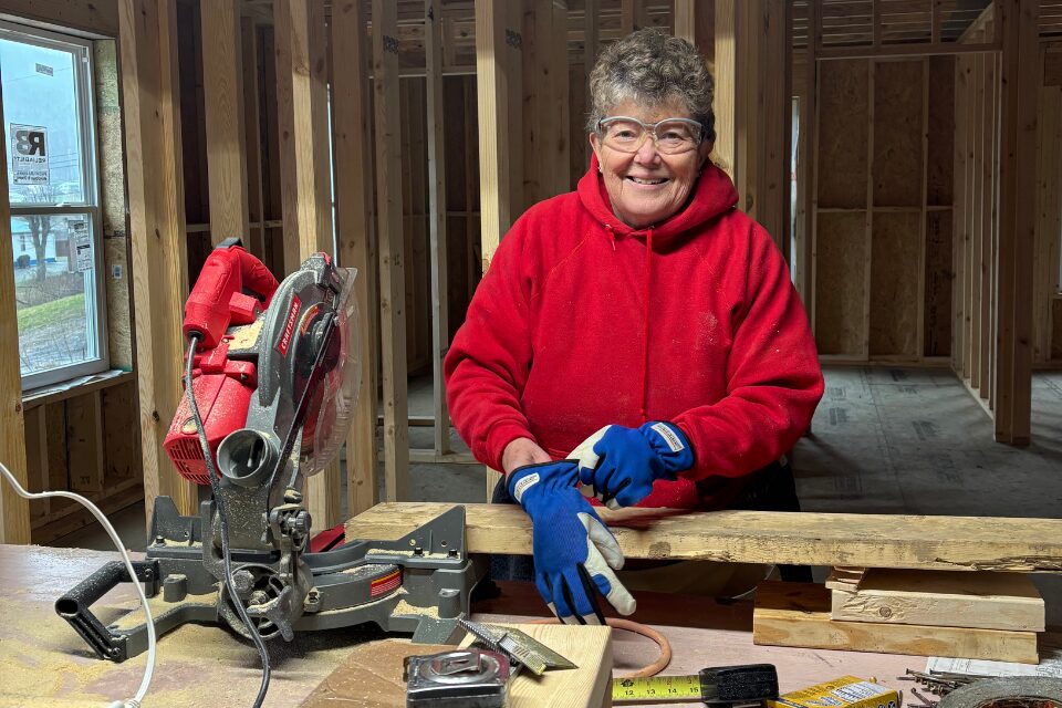 Woman using a saw