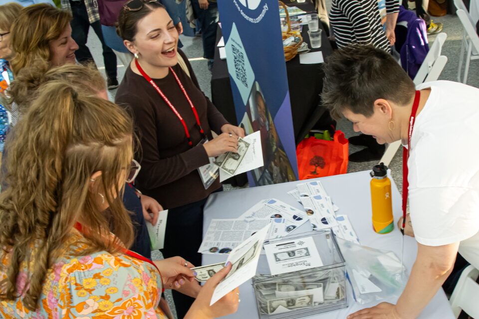 People talk during a community fair