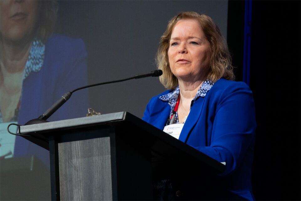 Woman speaking at podium