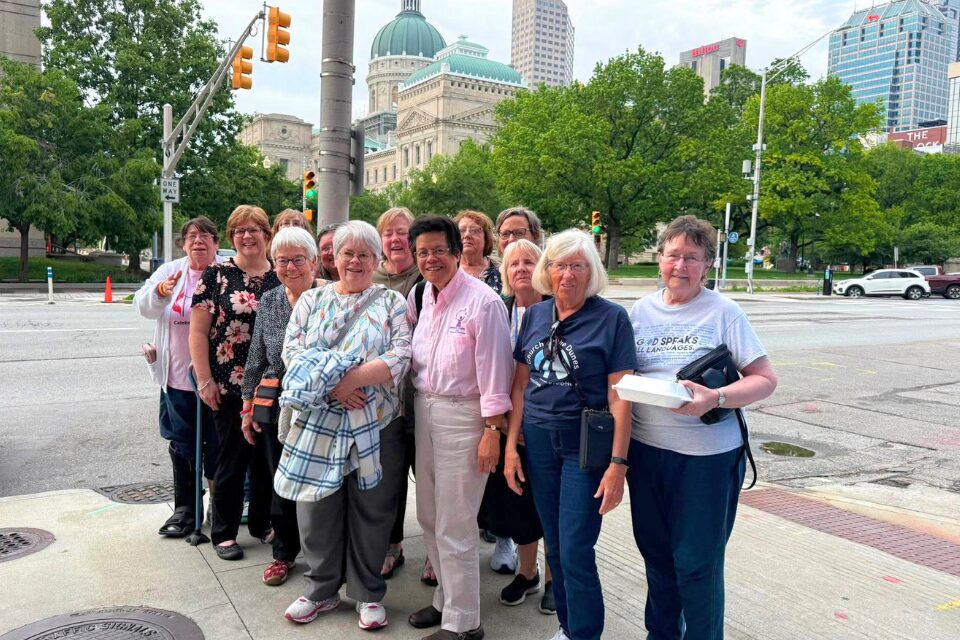 Group of women standing in front of Indiana Statehouse
