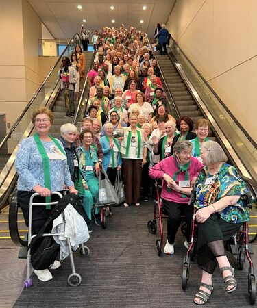 Women standing on a set of stairs