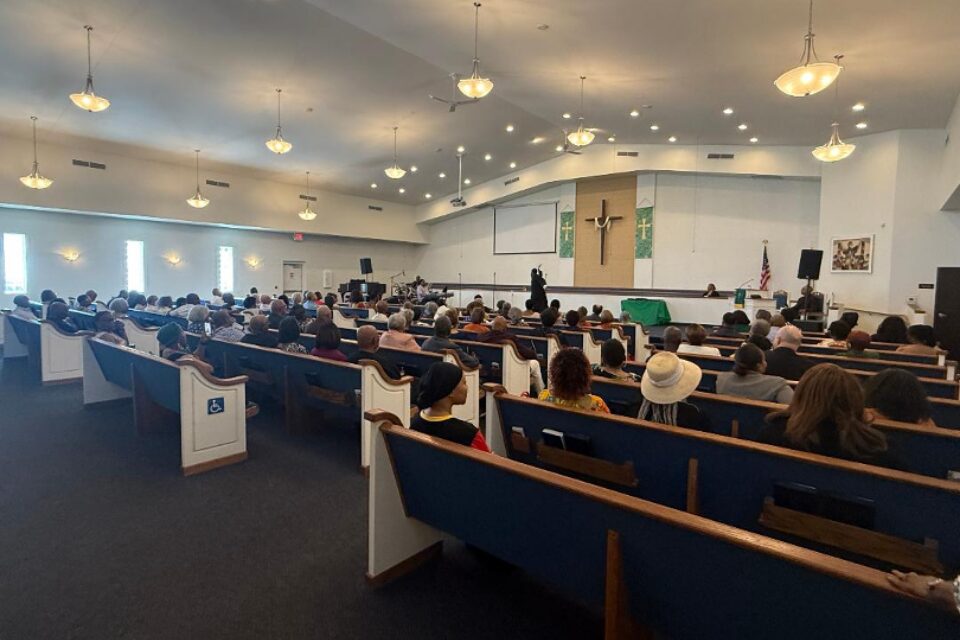 People sitting in a church sanctuary