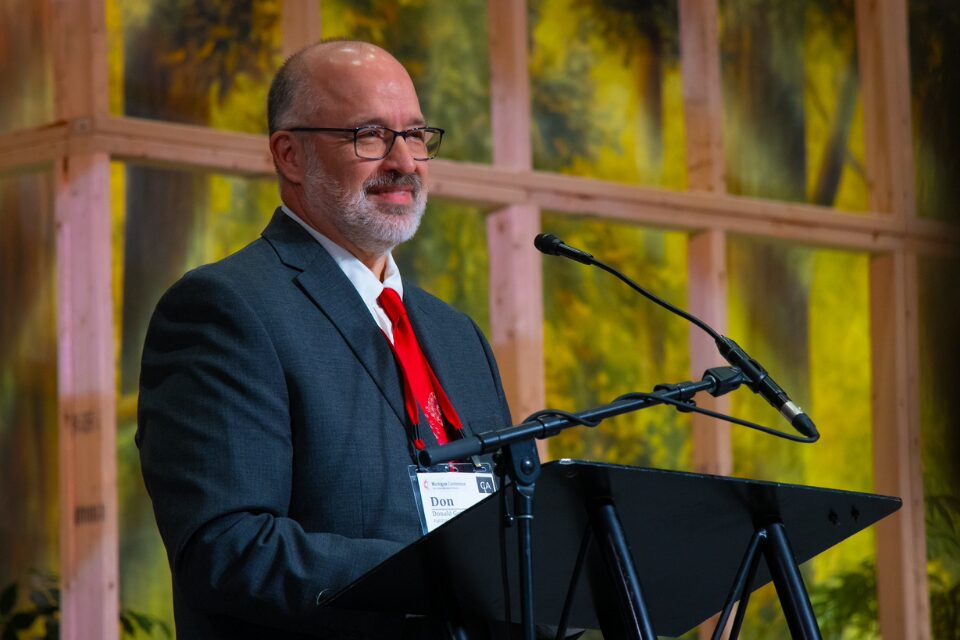 Man speaking at conference
