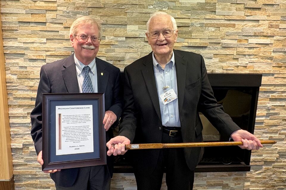 Retired pastor receiving an award