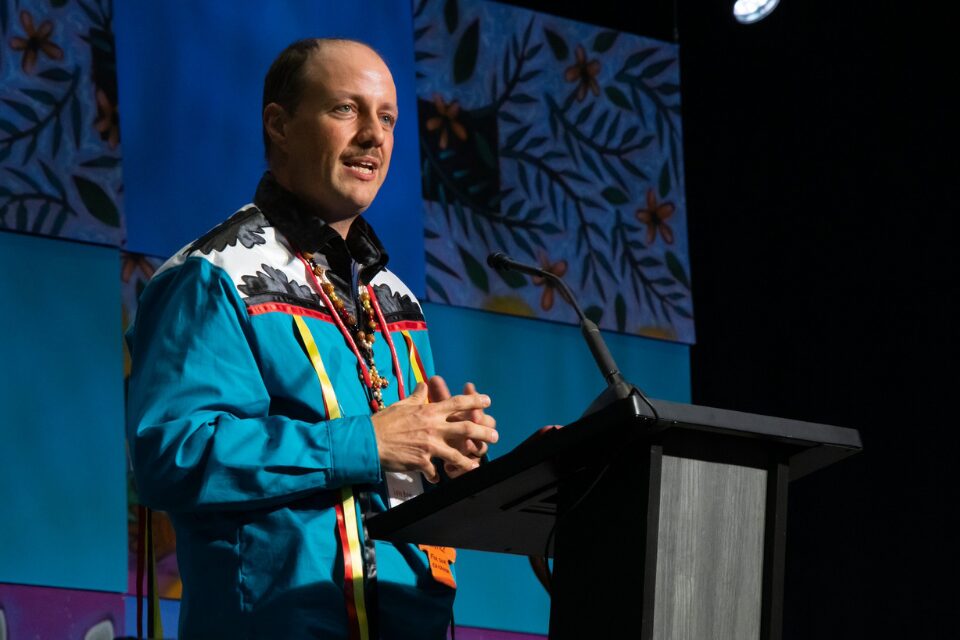 Native American elder speaking at conference