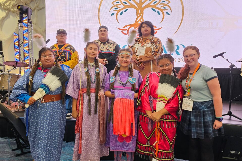 Youth with a Native American delegation