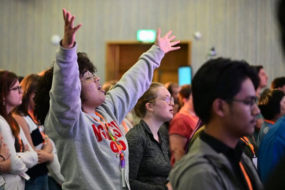 Young people worshiping God