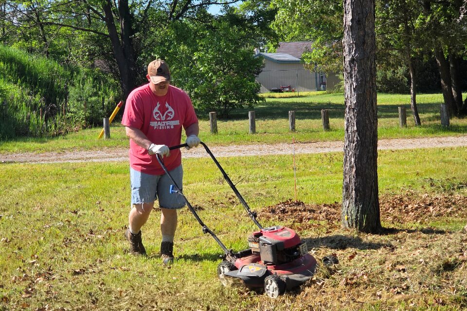 Man mowing grass