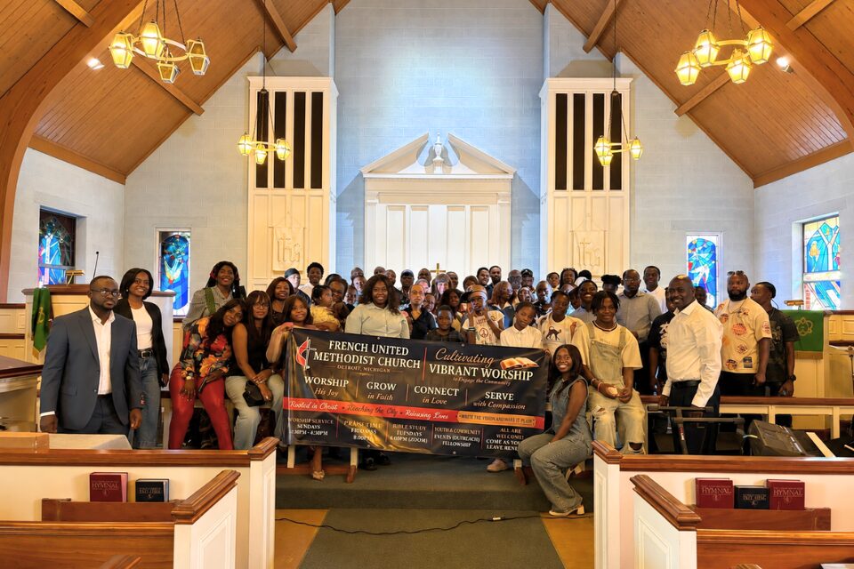 Church members holding banner