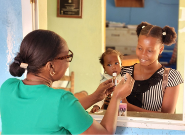Doctor with mother and child