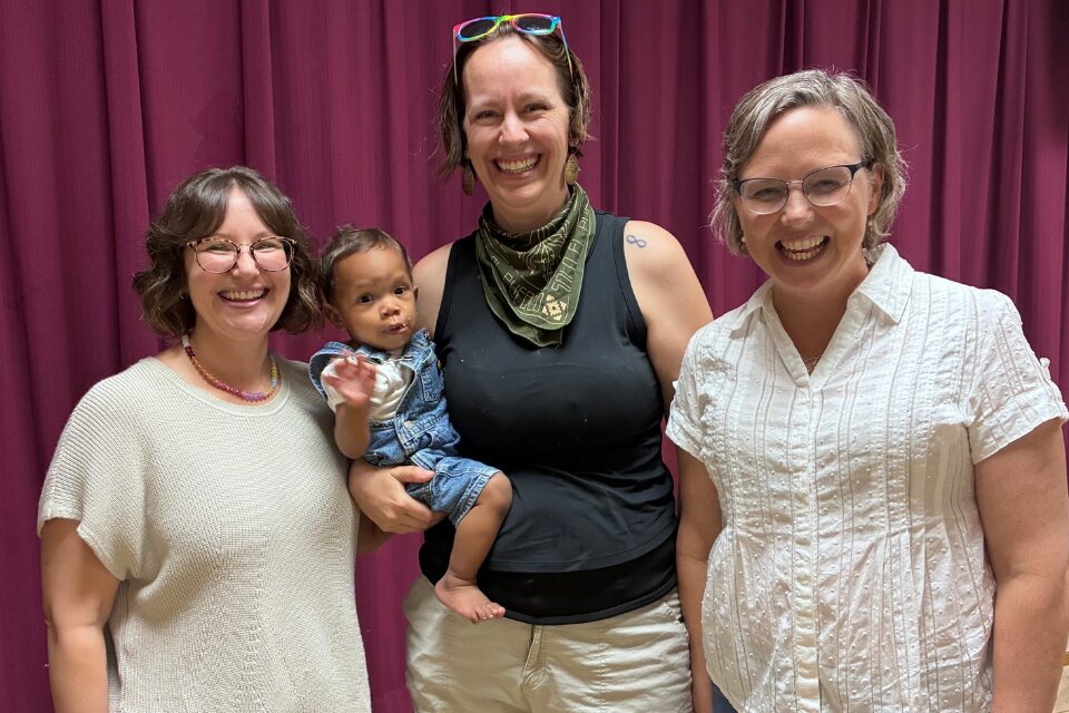 Three adults and a baby
