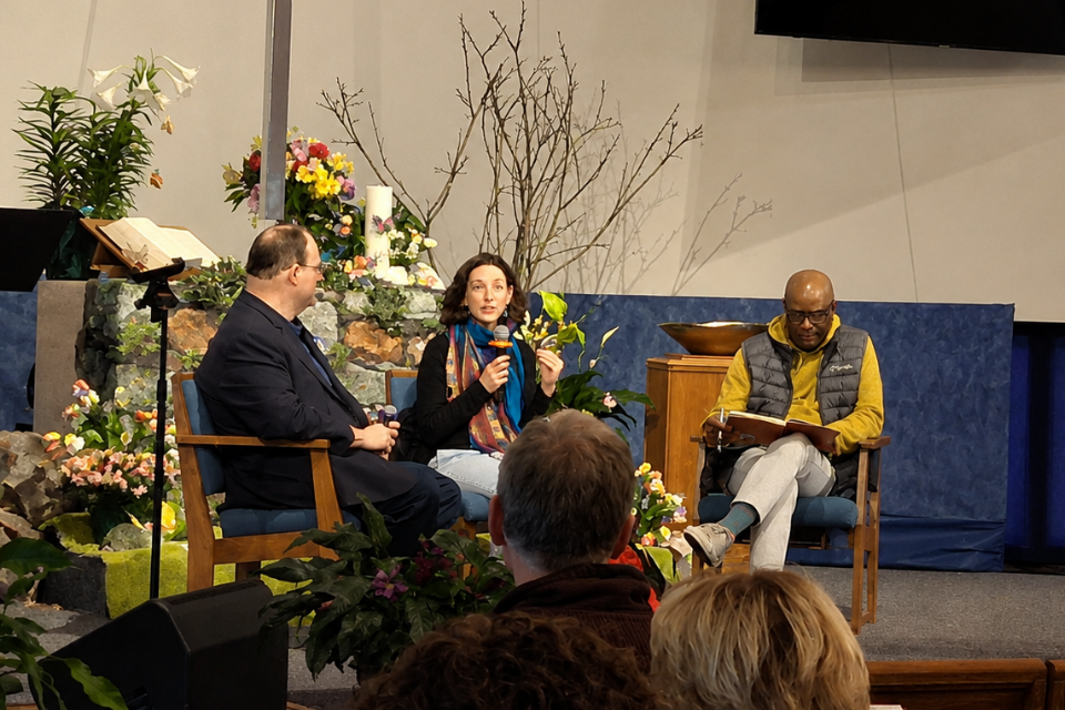 Faith members speak at a church