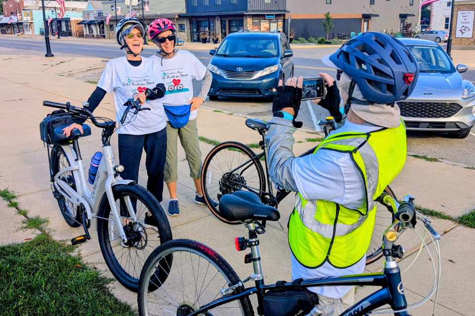 Bike riders pose for a photo