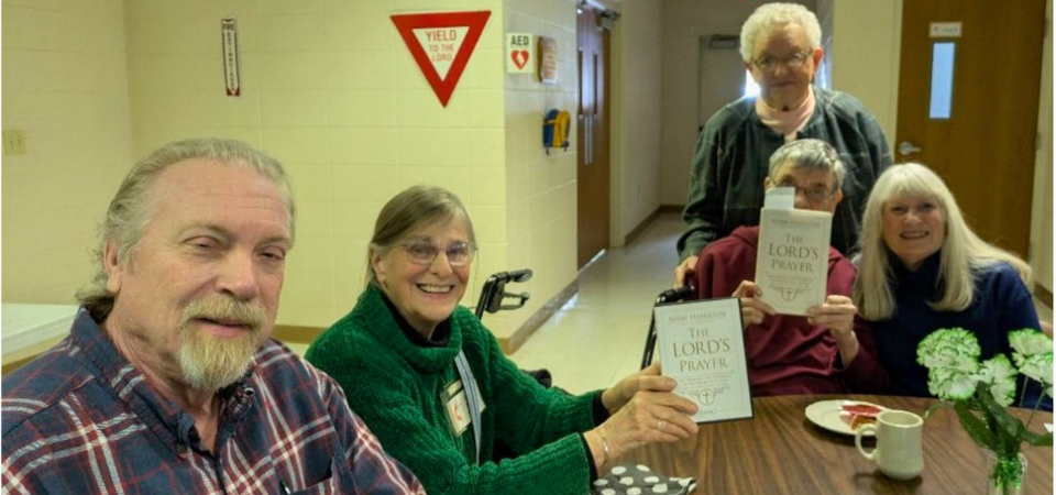 People holding books in a book study