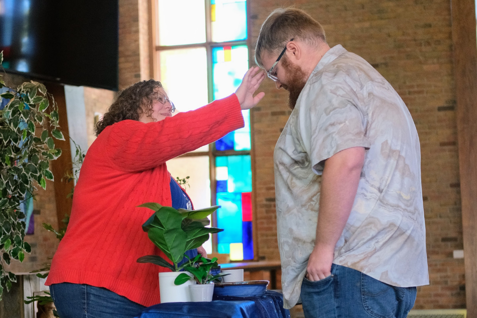 Person being anointed with oil