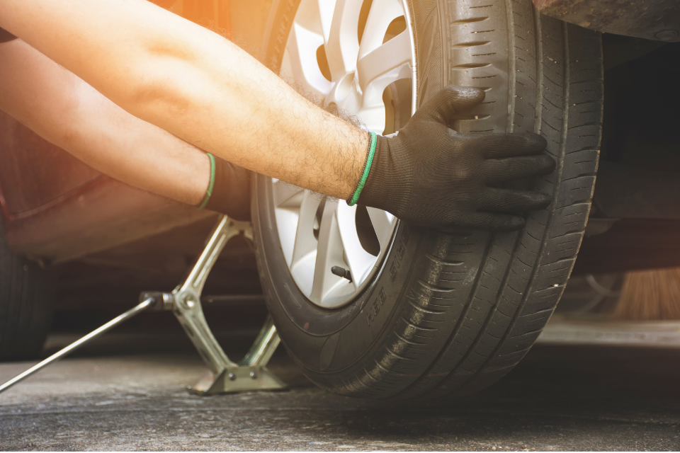 Person changing a tire